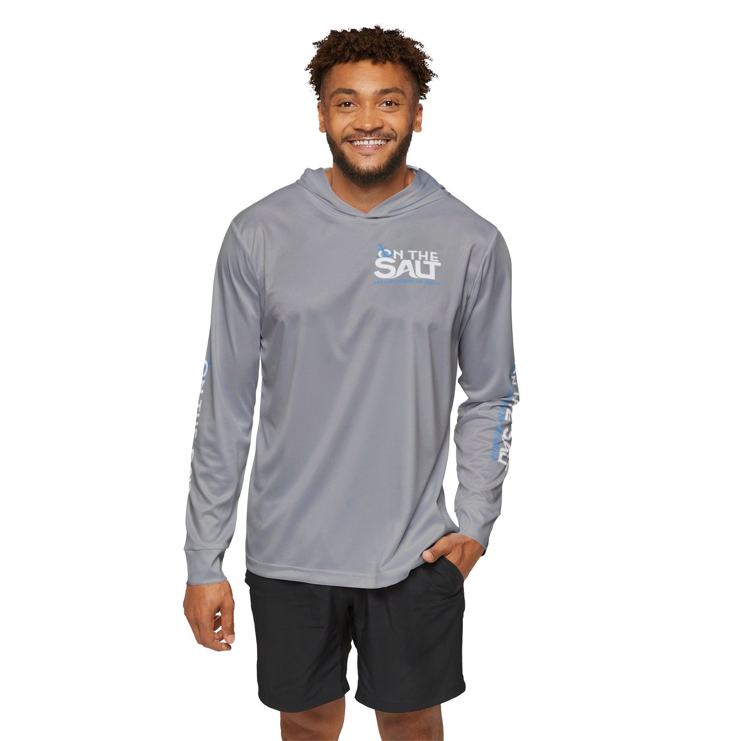Man wearing a gray long-sleeve shirt with 'In The Salt' logo 