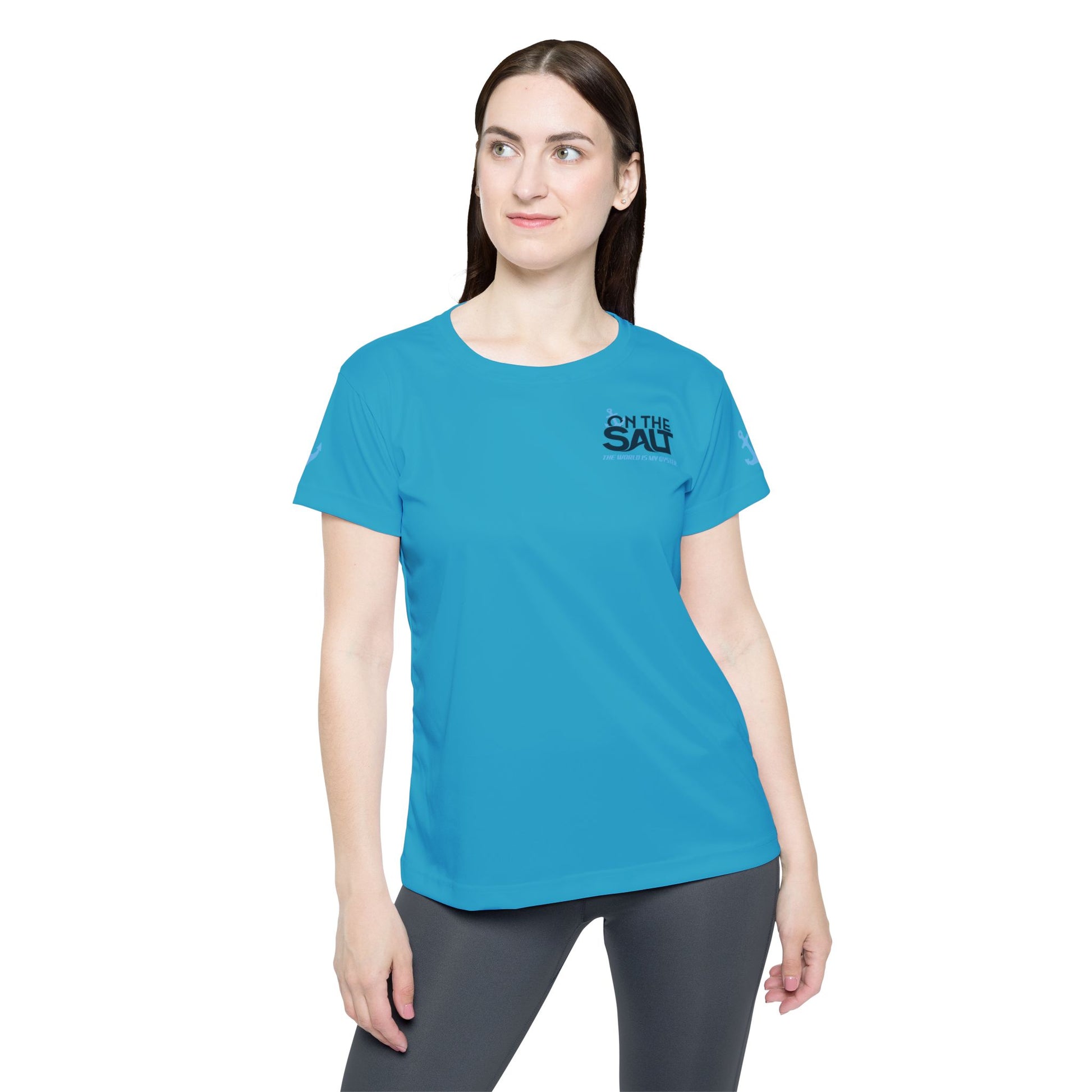 Woman wearing a blue t-shirt with 'On The Salt' logo on a white background